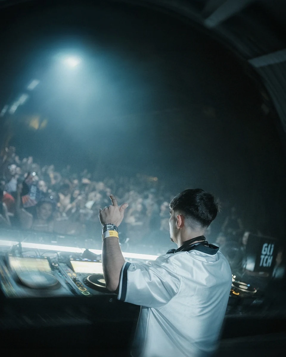 INVERTED facing the crowd during a DJ set